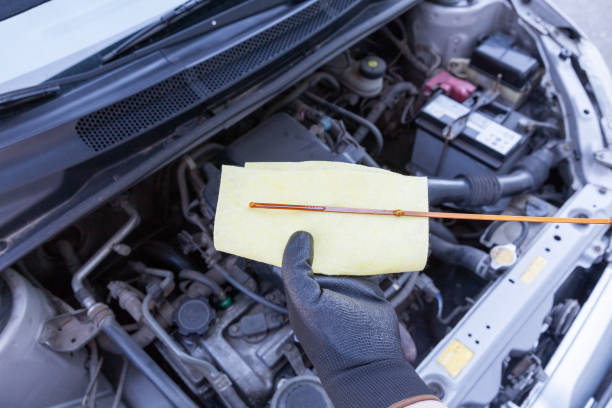 istock Checking motor oil level in the car. New engine lubricant. 698162848