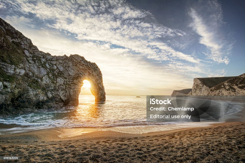 Sunset at Durdle Door in Dorset Beach Stock Photo