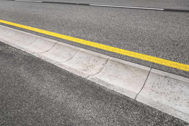 istock Drain channel on the asphalt road. 698185132