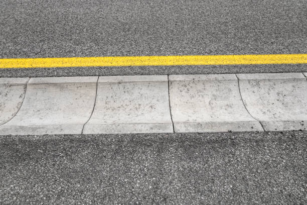 istock Drain channel on the asphalt road. 698185504