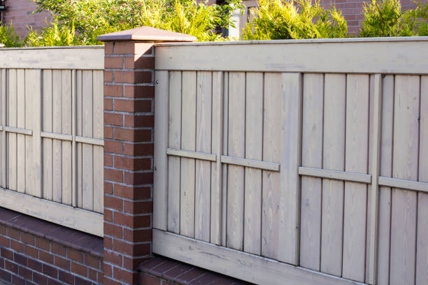 istock A pleasant sunny backyard with green grass and a nice wood fence 698188216