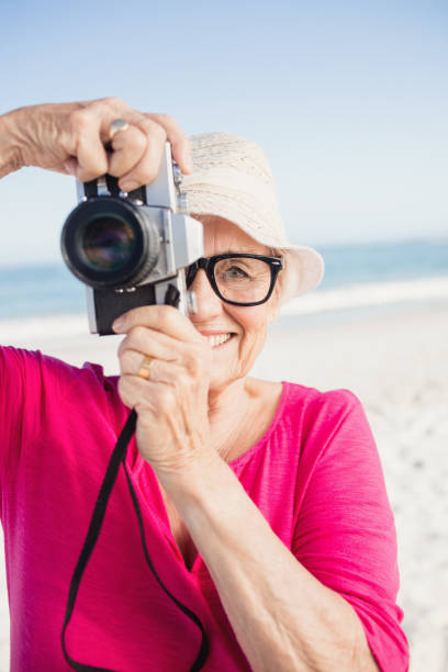 istock Senior woman taking picture 698188406