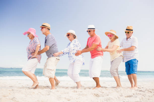 istock Happy senior friends dancing 698189082