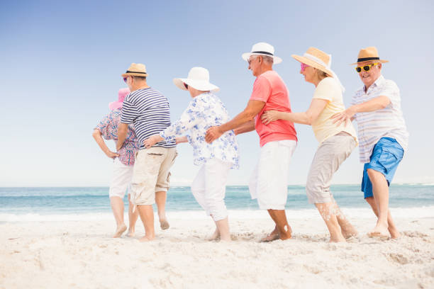 istock Happy senior friends dancing 698189152