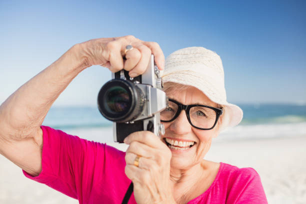 istock Senior woman taking picture 698189290