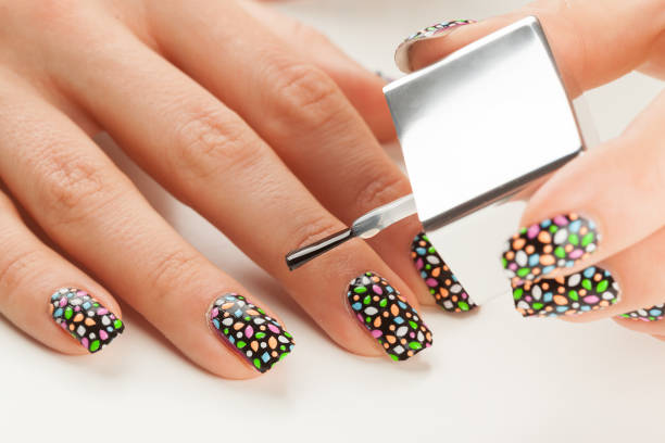 istock Beautiful manicure process. Nail polish being applied to hand 698189294