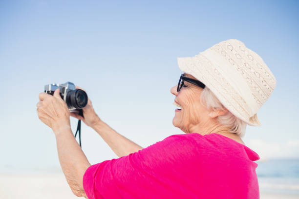 istock Senior woman taking selfie 698190210