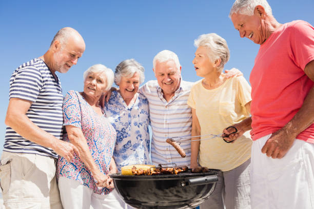 istock Senior friends having a barbecue 698190360