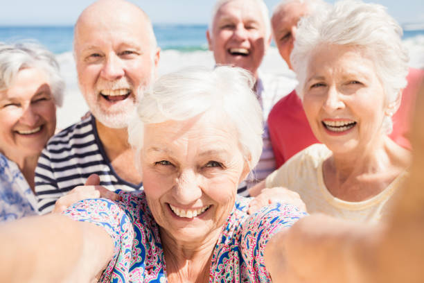 istock Senior friends taking selfie 698190450