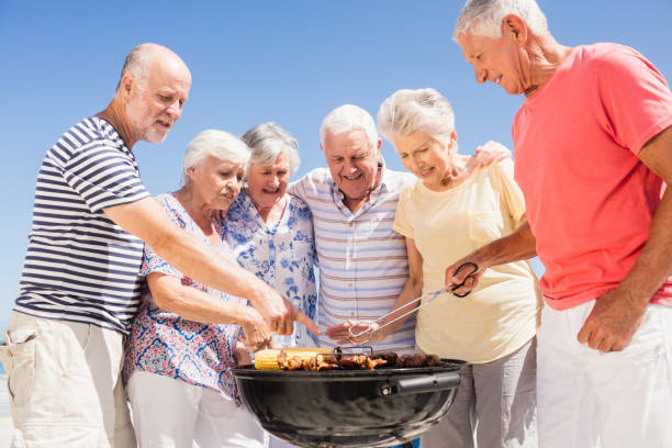 istock Senior friends having a barbecue 698190458