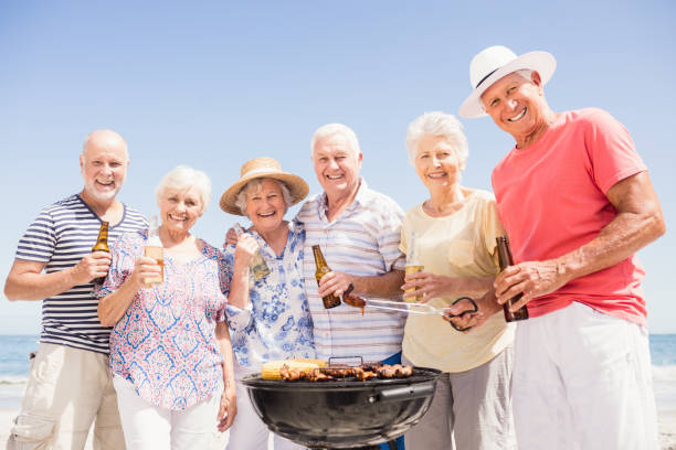 istock Senior friends having a barbecue 698195412