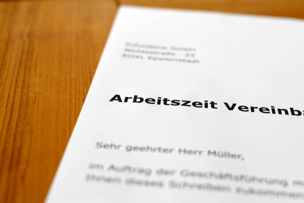 istock A letter on a wooden desk - working hours 698196378