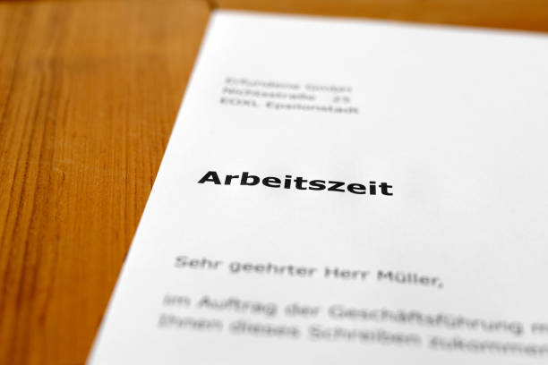 istock A letter on a wooden desk - working hours 698196430