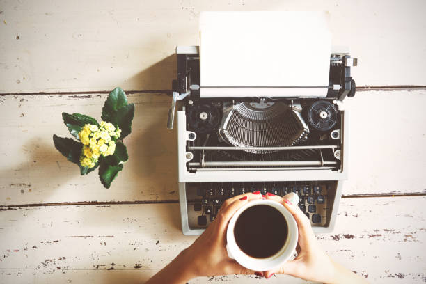 istock Vintage typewriter on  wooden background 698196612