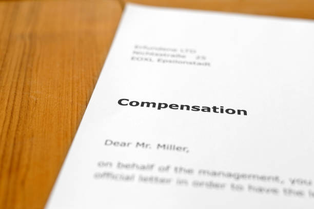 istock A letter on a wooden desk - Compensation 698196862