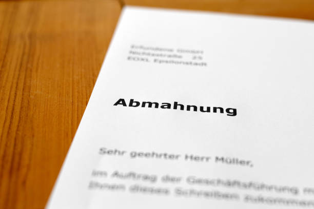 istock A letter on a wooden desk - Warning 698196988