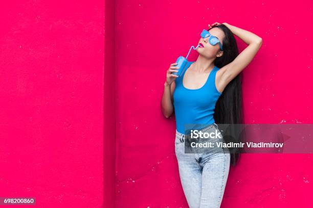 Woman In Blue Stock Photo - Download Image Now - Long Hair, Straw, 25-29 Years