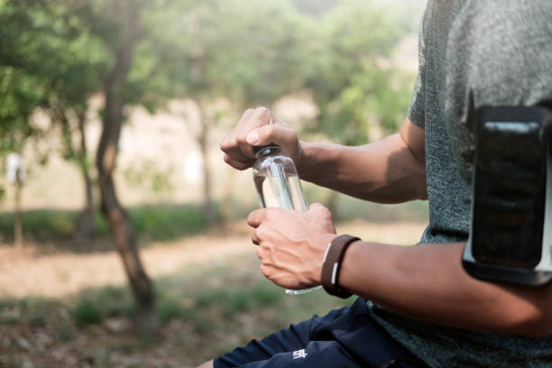 istock Sport man open water bottle. Sports concept. 698202546