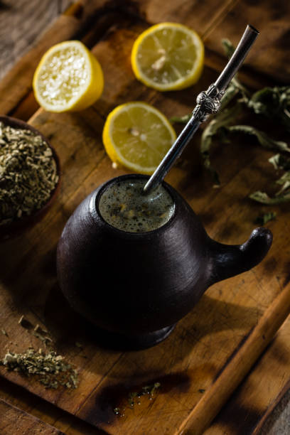 istock Latin American hot drink herb tea - Yerba mate in clay mug 698203002