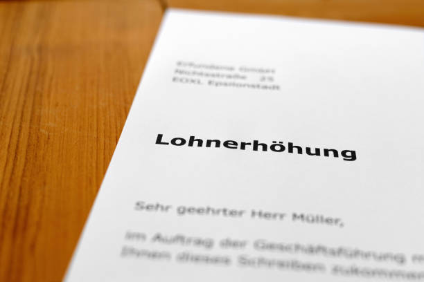 istock A letter on a wooden desk - pay increase 698205678