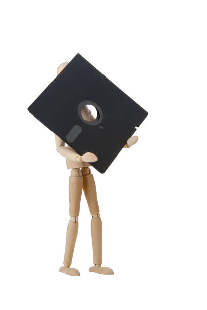 istock Wooden doll with 5.25 inch flopppy 698223694