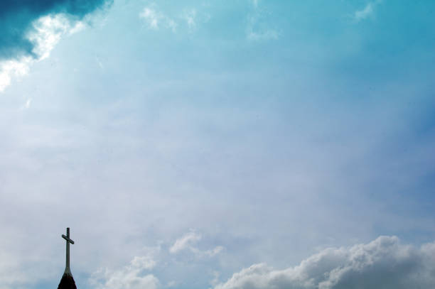 istock Church steeple and cross with clouds   copy space 698238980