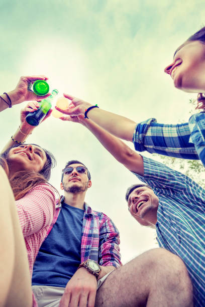 istock Happy group of young friends toasting with beer 698258212