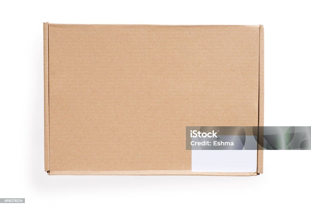 Closed cardboard box with blank white label. Isolated on white, clipping path included. Closed cardboard box with blank white label. Isolated on white, clipping path included. Top view Box - Container Stock Photo