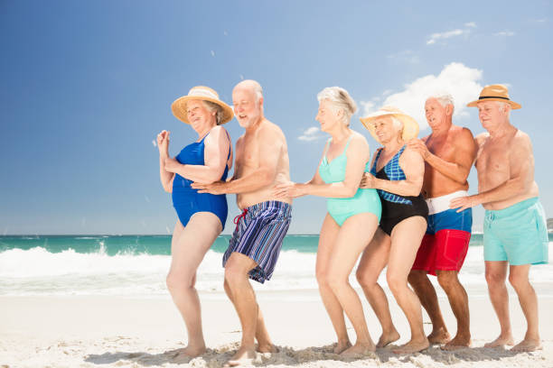 istock Smiling senior friends dancing 698285130