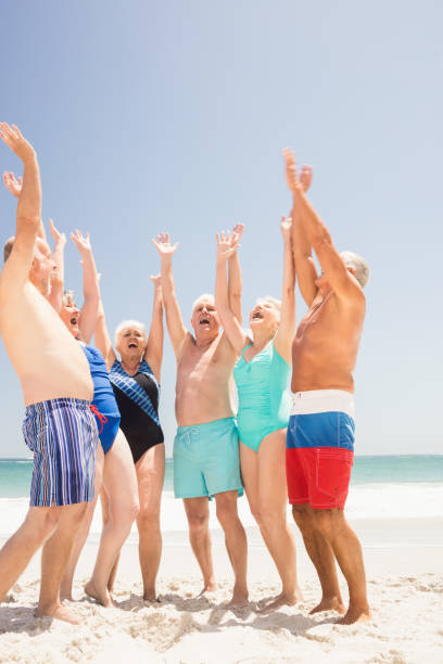 istock Senior friends cheering together 698289084