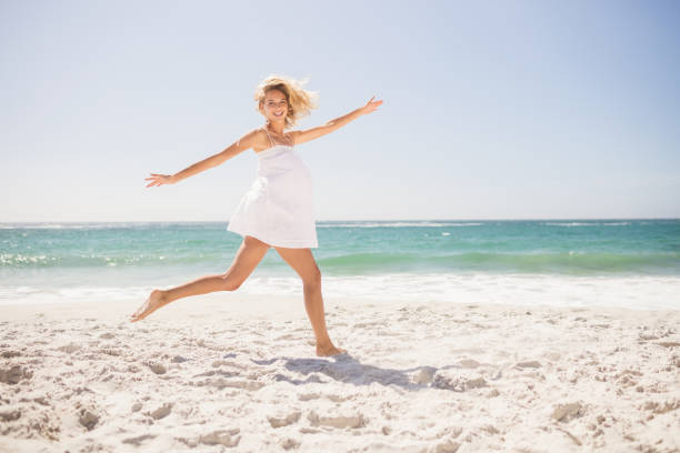 istock Pretty blonde woman jumping 698318228