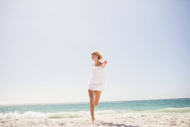 istock Pretty blonde woman jumping 698318316