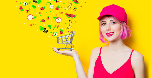 young woman with shopping cart - orange beauty serious retro revival imagens e fotografias de stock