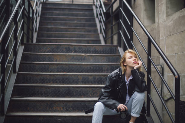 istock Beautiful girl with camera 698336232