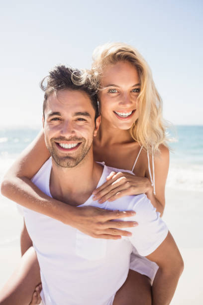 istock Boyfriend giving piggy back to girlfriend 698340132