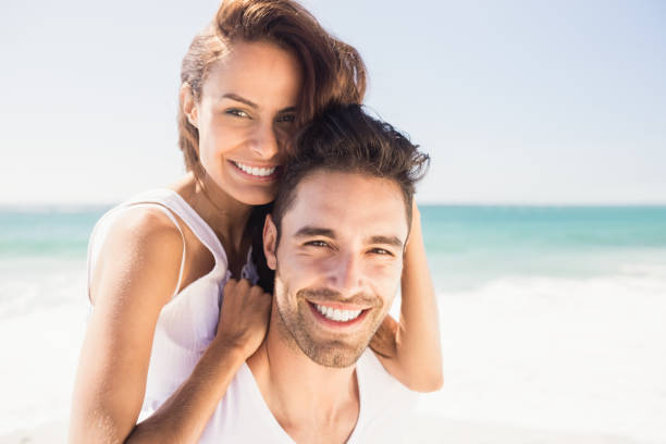 istock Boyfriend giving piggy back to girlfriend 698343126