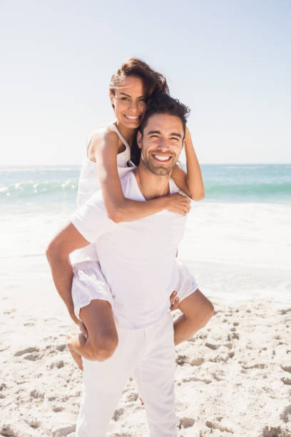 istock Boyfriend giving piggy back to girlfriend 698343162