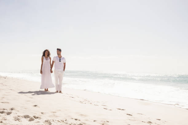 istock Smiling couple holding hands 698343960