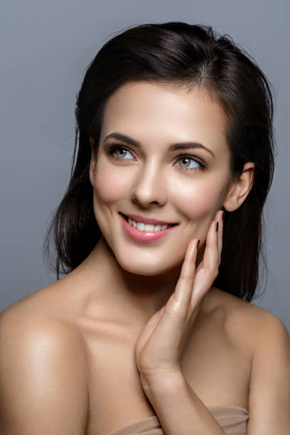 istock Beautiful girl with glowing skin 698348134