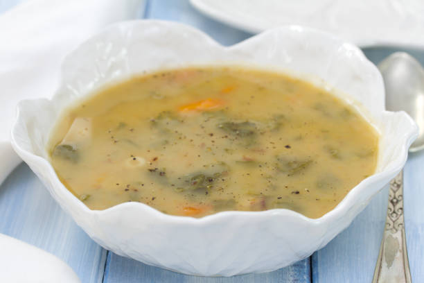 istock vegetable soup in white bowl on blue background 698348466