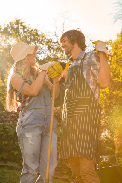 istock Smiling couple in the garden 698355230