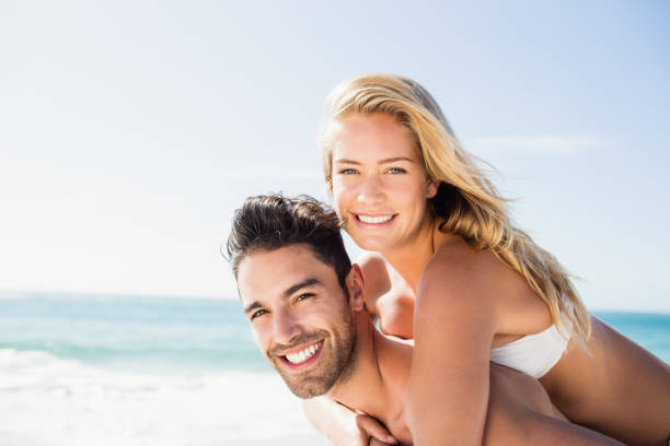 istock Boyfriend giving piggy back to girlfriend 698367178