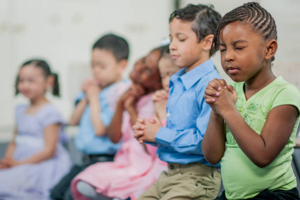 istock Praying Together in Sunday School 698371748