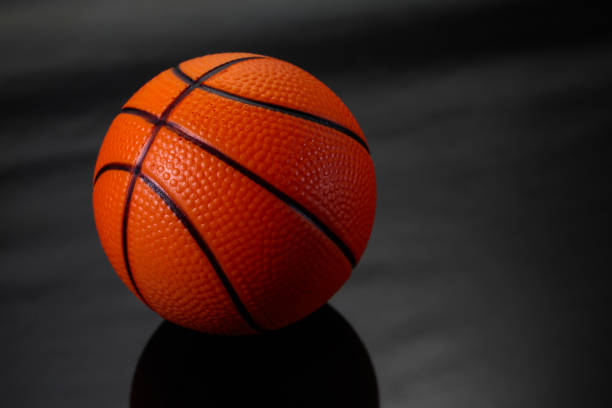 istock Ball basketball on black background. 698378378