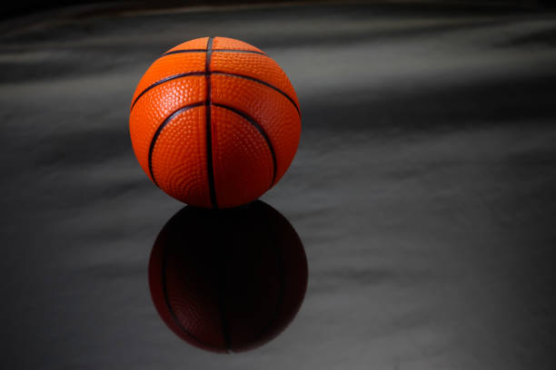 istock Ball basketball on black background. 698379382