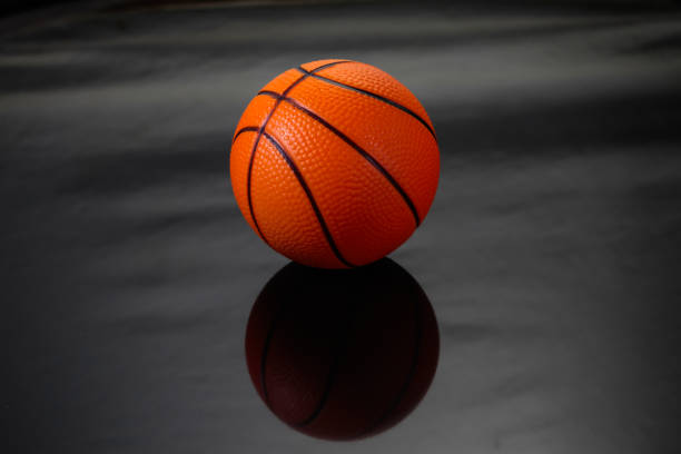 istock Ball basketball on black background. 698382736