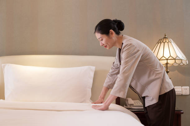 istock woman services in modern bedroom 698396656