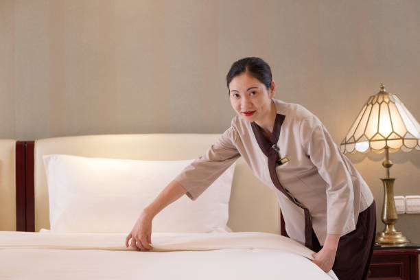 istock woman services in modern bedroom 698397042
