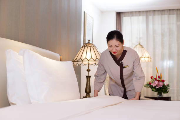 istock woman services in modern bedroom 698397524