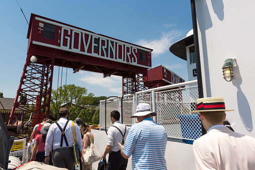 New York, USA - Jun 10, 2017: The welcome sign to Governors Island on the Manhattan side from the ferry at the dock early in the day as passengers disembark the ferry.